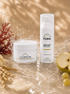 Siero Viso Anti-Age e Crema Viso Nutriente AHA PURA, i due prodotti della routine Pelle Nuova